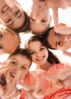 group-of-children-making-hand-peace-gesture