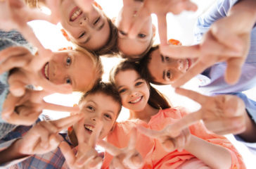 group-of-children-making-hand-peace-gesture