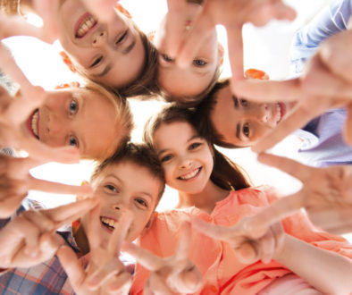 group-of-children-making-hand-peace-gesture