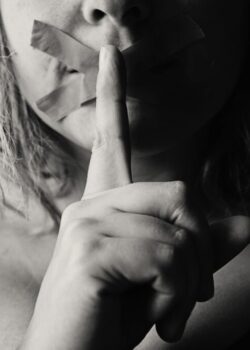 woman-placing-her-finger-between-her-lips-568025/