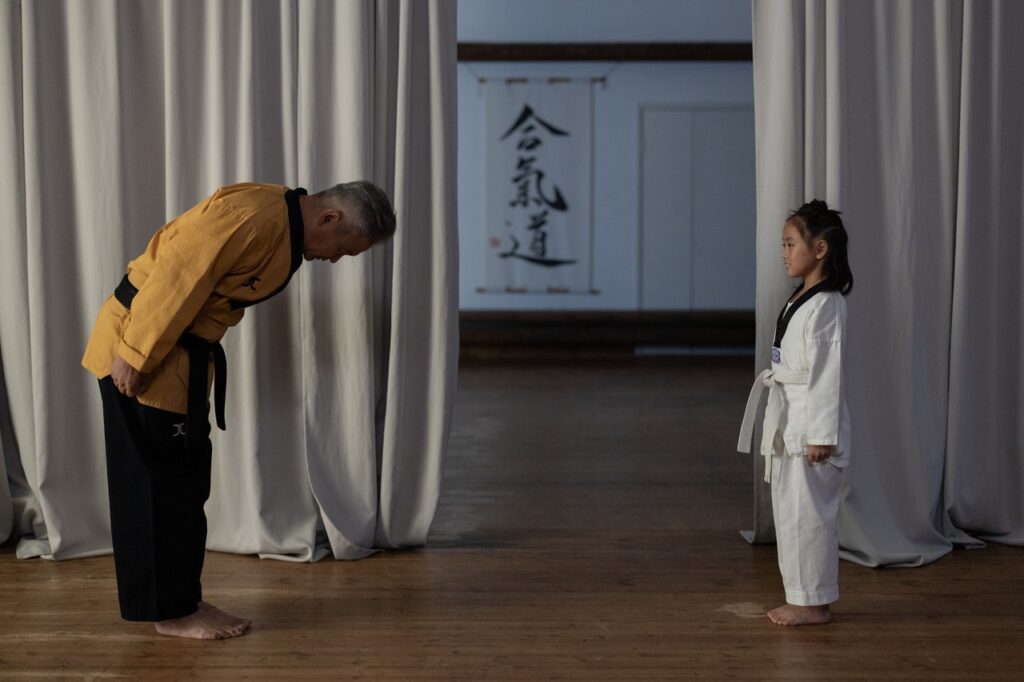 a-martial-arts-instructor-bowing-to-a-student-7991209/